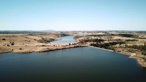 Aerial-view-of-the-Upper-Coliban-Reservoir-dam-wall,-central-Victoria,-Australia,-January-2019