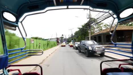 Wide-angle-shot-at-the-back-of-a-songthaew-bus-during-the-day-in-Thailand