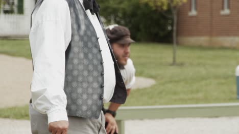 1860's-Baseball-umpire-reenactor-watches-a-baseball-game