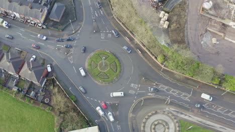Overhead-view-of-the-roundabout-on-Victoria-road,-Vicky-road-that-leads-to-Hanley-city-centre-in-Stoke-on-Trent,-poor-area-filled-with-council-housing-and-immigration,-congestion-and-poor-city-plan