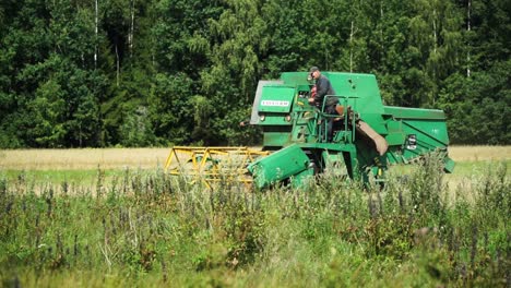 There-is-green-harvester-in-the-grain-field