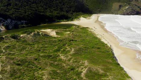 Drone-view-of-Lagoinha-Do-Leste-beach,-Florianopolis,-Santa-Catarina,-Brasil