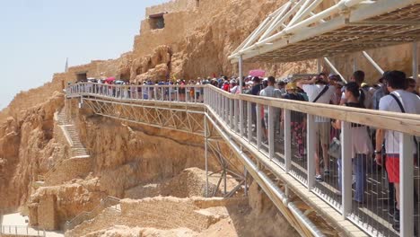 Line-of-tourists-on-the-Masada-fortress-rock,-Israel