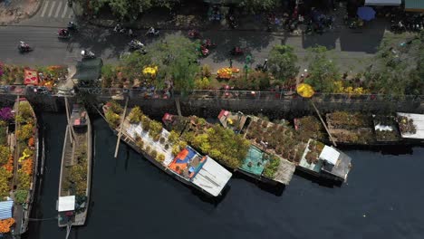 top-down-slow-tracking-Aerial-view-of-floating-flower-market-in-Saigon-or-Ho-Chi-Minh-City-in-Vietnam