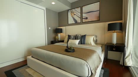 Bedroom-furnished-with-the-stylish-bedding,-couch-and-lighting-furnitures