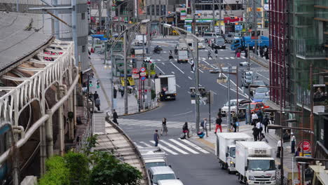 Slow-motion-shot-of-people-on-the-Ueno-shopping-street,-at-a-cloudy,-autumn-day,-in-Tokyo,-Japan