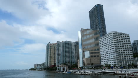 Miami-Modern-Buildings-on-Waterfront-of-Biscayne-Bay,-Florida-USA,-Pan-Left-50fps