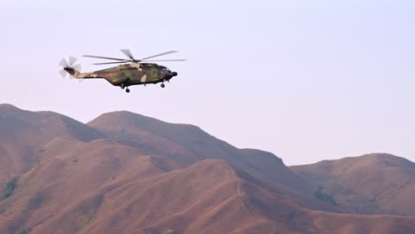 Chinese-People's-Liberation-Army-Z-20-Helicopter-from-Shek-Kong-Garrison-Base-in-Flight-over-Hong-Kong-Mountains