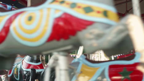 Families-on-carousel-ride-at-small-community-carnival-in-Pennsylvania,-Slow-Motion