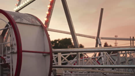 Children-riding-Looper-ride-at-summer-carnival-in-Pennsylvania,-Pan-Left