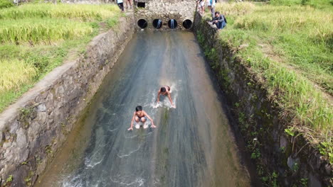 Indonesian-young-people-water-skiing-in-shallow-rivers