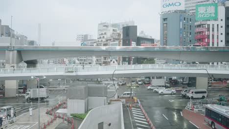 Real-Time-Scene-Of-Transportations-On-Busy-Overpass-Road-In-Shibuya-On-A-Rainy-Weather---wide-shot