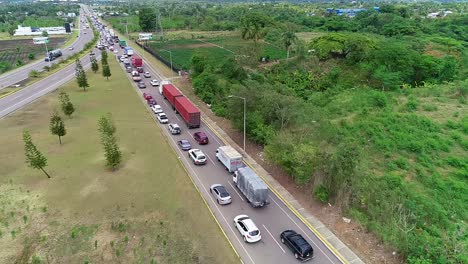 Aerial-view-over-a-queue-of-vehicles,-traffic-Jam-due-to-a-accident,-in-Brazil,-America---dolly,-drone-shot