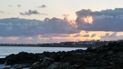Rocky-Beach-with-Sunset-Cloudscape-at-Holiday-Destination