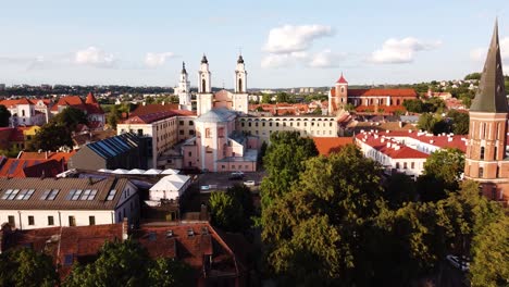 Kaunas-city-old-town-aerial-drone-shot-while-the-drone-is-flying-backwards-revealings-beautiful-church-towers