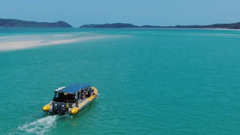 Aerial-drone-perpective-of-rubber-dinghy-boat-with-tourists-on-board