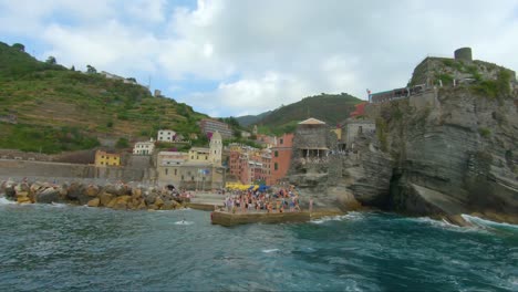 Beautiful-view-of-the-village-Vernazza-from-tour-boat-in-the-sea
