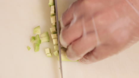 Chef-Cutting-Ripe-Avocado-Into-Small-Pieces-For-Sushi-Rolls