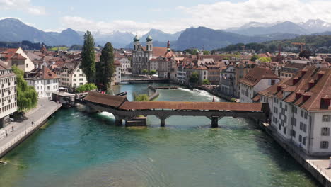 Aerial-dolly-of-historic-bridge-over-canal-in-Luzern,-Switzerland