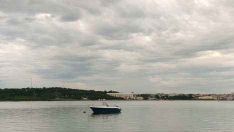 Empty-Boat-Moored-On-The-River-On-A-Cloudy-Weather---static-shot