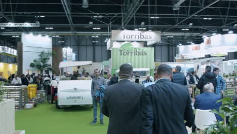 Wide-angle-shot,-panning-inside-busy-expo,-fruit-attraction-food-show,-Madrid,-Spain