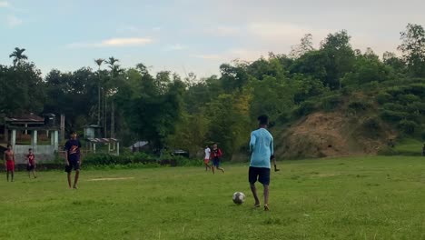 Village-boys-in-Sylhet,-Bangladesh-play-football-without-shoes
