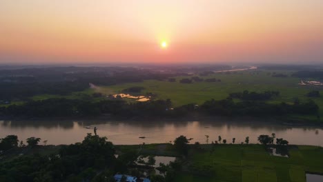 Sunset-over-rural-Bangladesh,-rivers-and-meadow