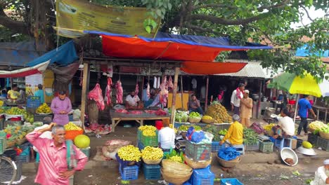 Passing-Near-Local-Fresh-Fruits-Market-With-Colorful-Umbrellas,-Baccaurea-motleyana