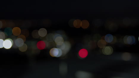 Nighttime-cityscape-in-Wellington,-focus-pull-and-Bokeh-lighting-wide-shot