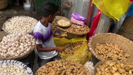 Slow-motion-shot-of-a-vendor-cutting-and-selling-fresh-spice-in-the-streets-of-Sylhet