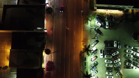 Aerial-view-from-above-flying-drone-car-moving-and-standing-on-parking-lot-in-modern-city