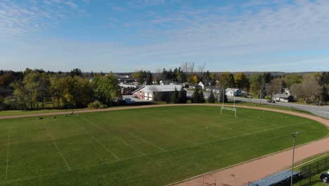 Drone-flying-up-next-to-football-field-in-King-City