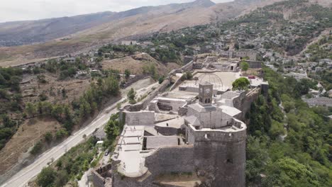 Fly-over-Gjirokaster-Fortress-with-beautiful-view-of-Ottoman-town,-Gjirokaster-Albania