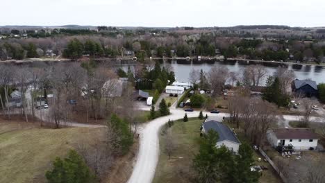 Aerial-shot-circling-over-lakeside-town-in-the-Kawartha's-in-spring