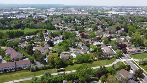 Drone-circling-over-overcast-neighborhood-in-summer