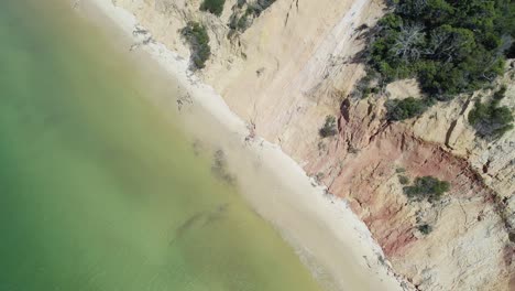 Ocean-And-Sand-Dunes-In-Rainbow-Beach,-Queensland,-Australia---aerial-top-down