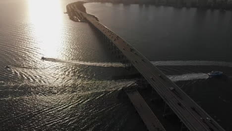 Traffic-on-William-Powell-Bridge-during-sunset,-Florida