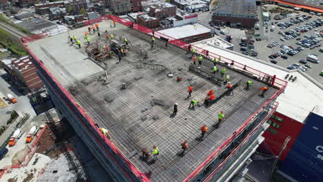 Drone-Shot-view-Of-building-and-Construction-workers