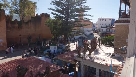 Crowded-Uta-el-Hammam-square-viewed-from-Balcony,-Touristic-Location-in-Chefchaouen-Medina