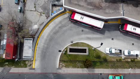 Top-down-shot-of-a-bus-stop-and-cars-on-a-Toronto-street-in-the-spring