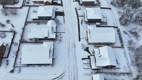 Overhead-view-of-a-residential-street-covered-in-a-sheet-of-fresh-snow