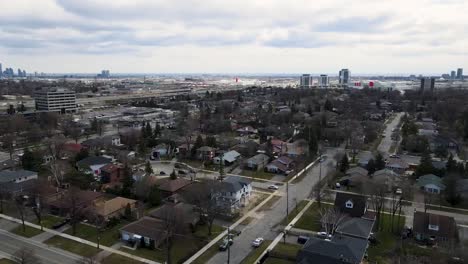 Aerial-shot-circling-over-grey,-winter-neighborhood-in-Toronto