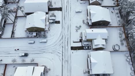 Aerial-view-of-a-snow-covered-=-residential-area