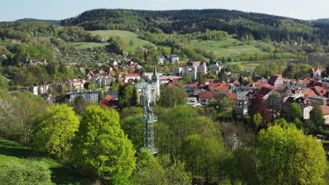 Modern-5G-telecommunications-BTS-mast-in-an-old-European-town-surrounded-by-green-hills