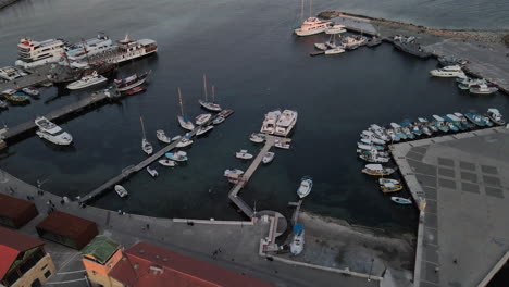 Aerial-over-Captivating-beauty-of-Pafos'-Harbour-at-sunset,-Cyprus