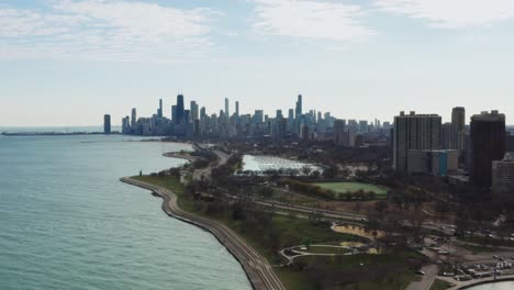 Aerial-view-of-Chicago-Downtown,-Diversey-Harbor,-US-Highway-41,-Belmont-Rocks-and-part-of-Lincoln-Park-on-sunny-autumn-day