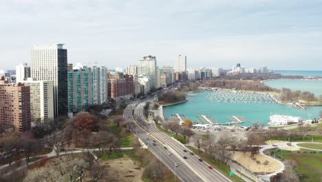 Chicago-lakeshore-apartments-and-condominiums,-empty-Belmont-Harbor,-US-Highway-41-and-S-Dusable-Lake-Shore-Drive