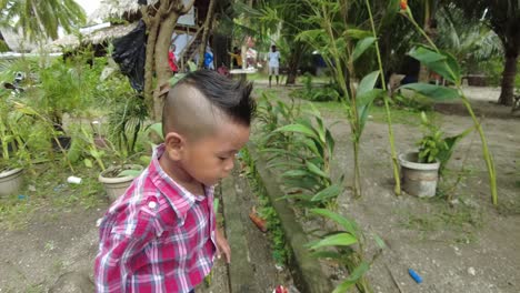 A-dynamic-following-shot-of-a-running-kid-playing-around-the-beach-resort