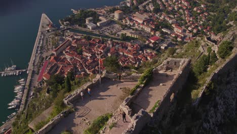 Ruins-of-Kotor-fort-on-mountain-top-above-harbor-city,-Montenegro