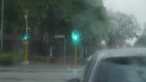 Drive-POV:-Sitting-at-red-traffic-light-on-Mansfield-Ave-as-rain-pours